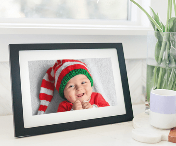 Image of baby dressed up as an elf on a digital photo frame