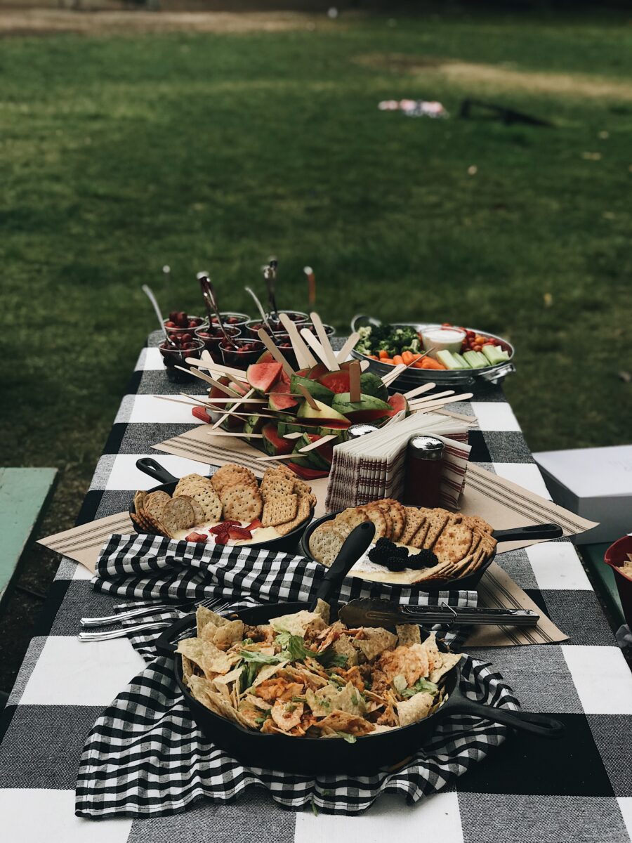 Picnic table with food at campground for 4th of July