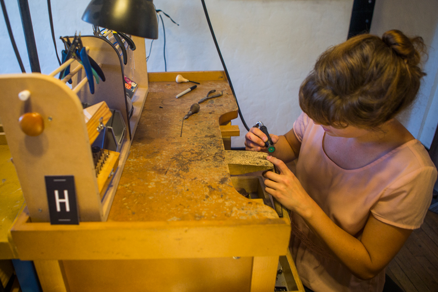 Woman working at a jeweler's bench