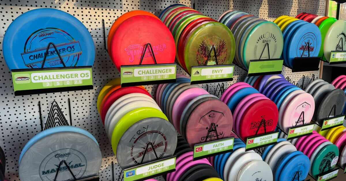 Racks of various disc golf discs