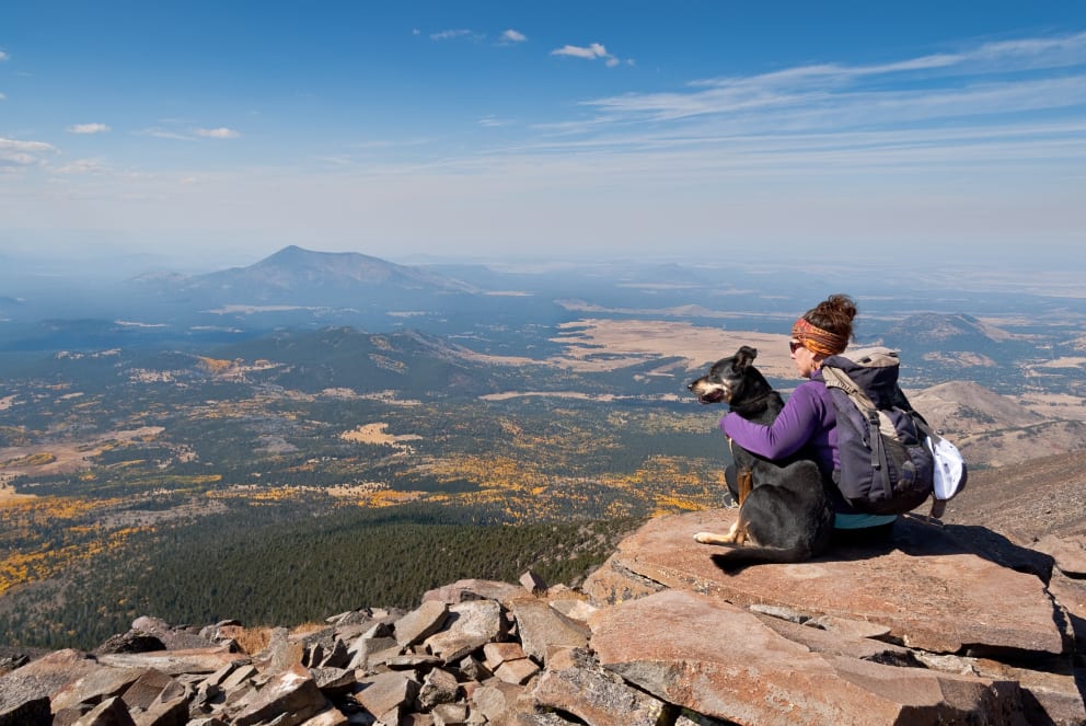 woman hiking with dog in arizona