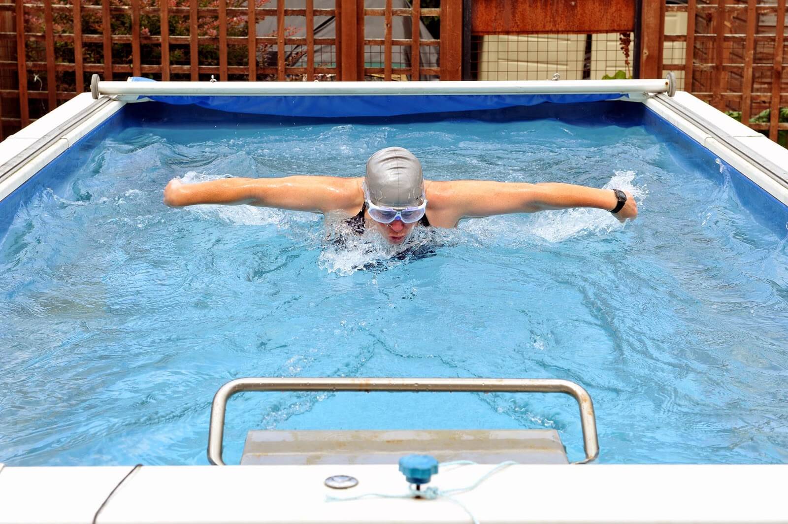 Open water swimmer Julie Bradshaw swimming butterfly in her Endless Pool