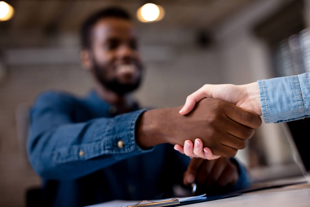 handshake with a payday loan representative in New Iberia