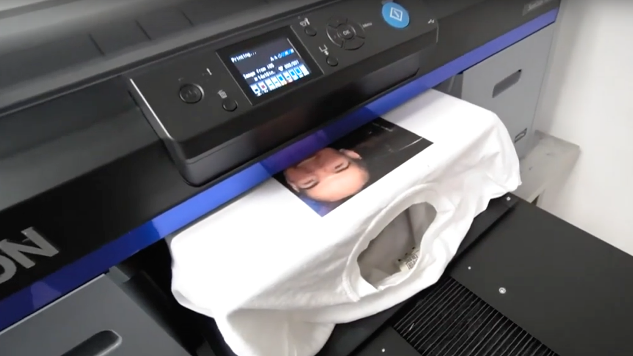 A DTG printer while it prints a t-shirt