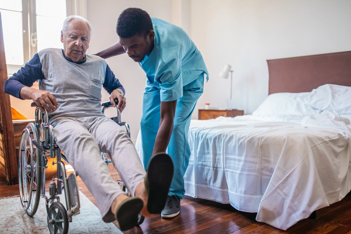 nurse helping person with a Medicare Advantage I-SNP in wheelchair