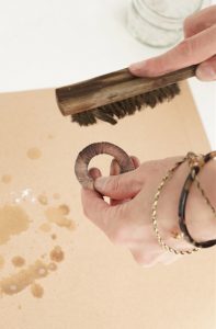 Burnishing a metal blank using a brass brush