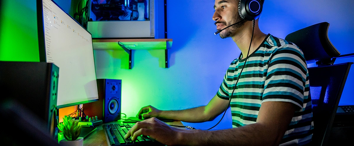 Person with a gaming headset on checking their downloads