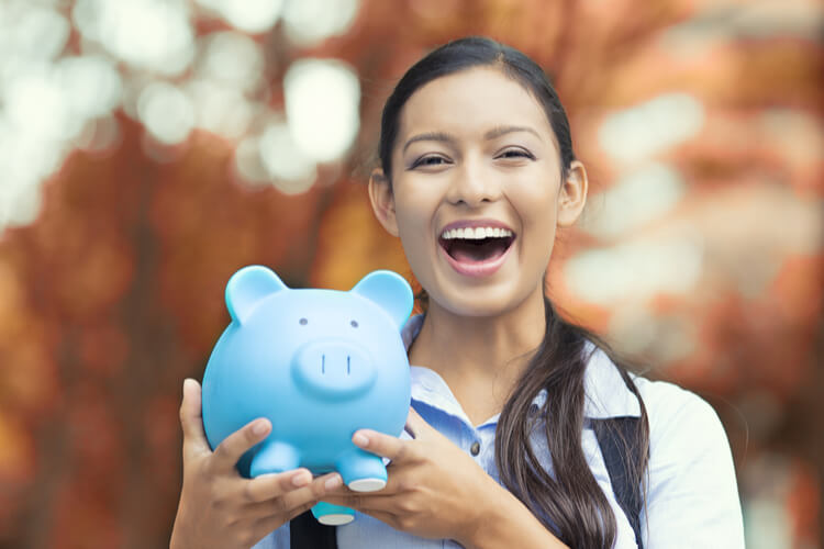 woman with piggy bank full of last minute title loan cash