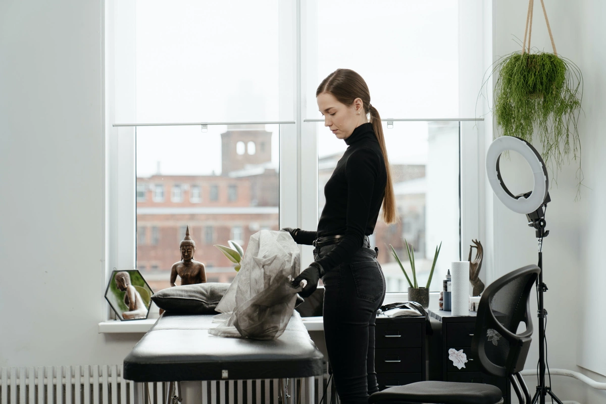 tattoo artist in her studio