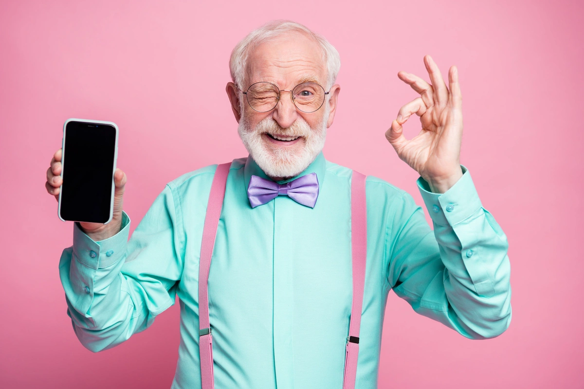 man with phone, happy medicare covers telehealth