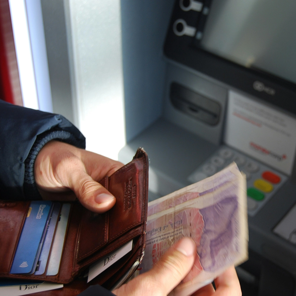 Withdrawing at ATM_.webp