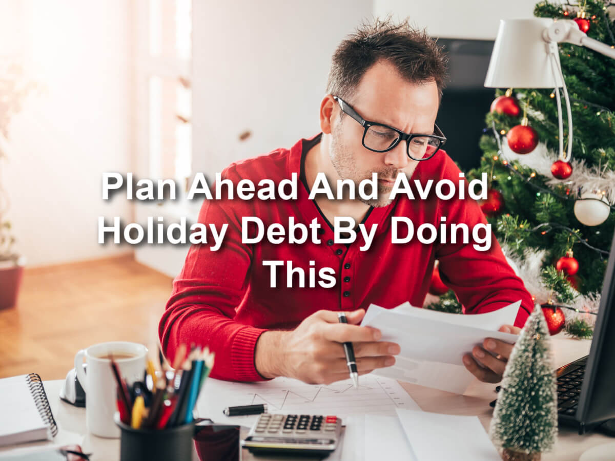 man working on budget to avoid holiday debt with payday loan