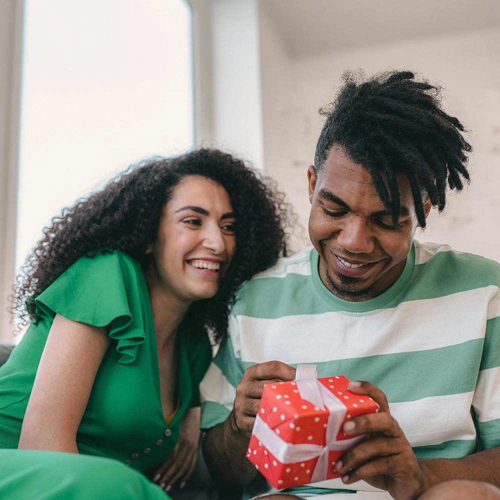 Couple exchanging gifts.webp
