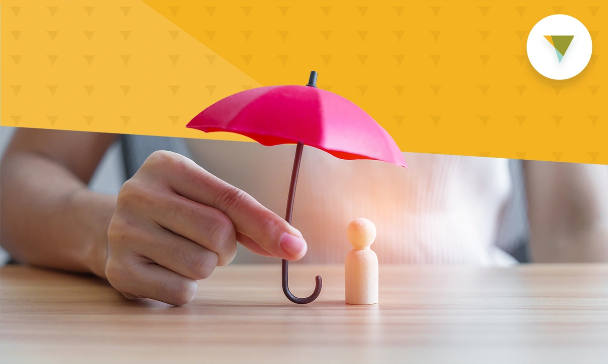 Small pink umbrella being held over a white pawn representing insurance.