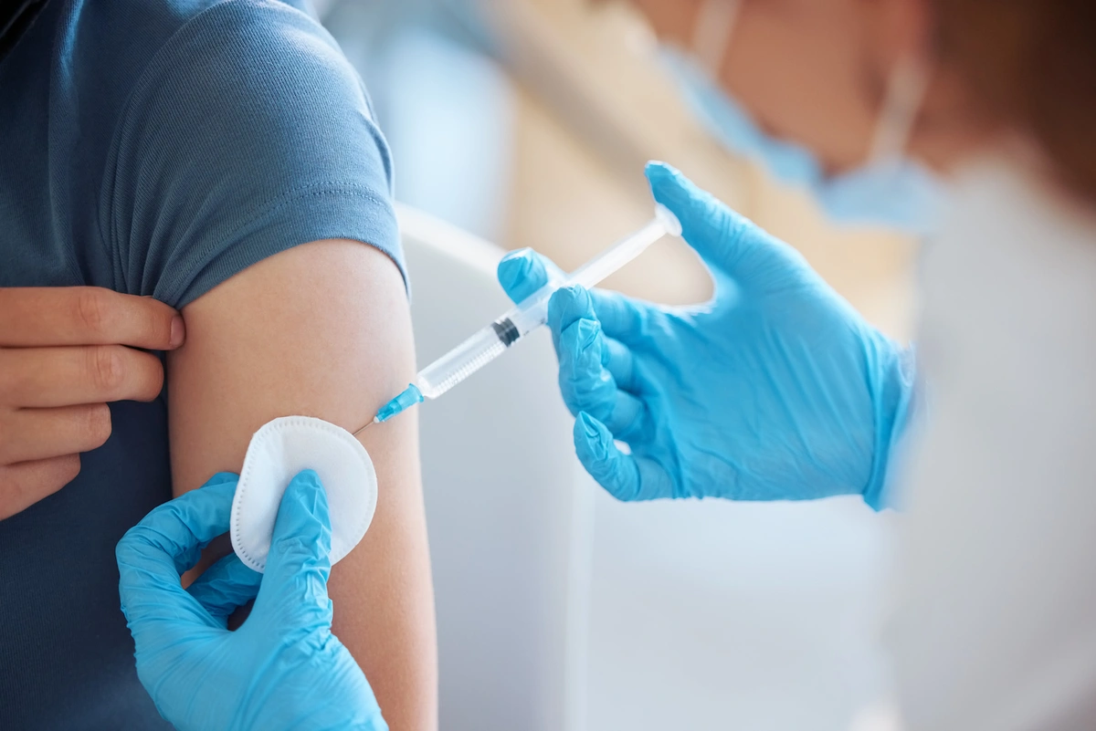 someone receiving a vaccine, a preventive service covered by Medicare