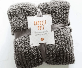 A fluffy dark grey fabric wrapped in ribbons and a label that says "Snuggle suit"