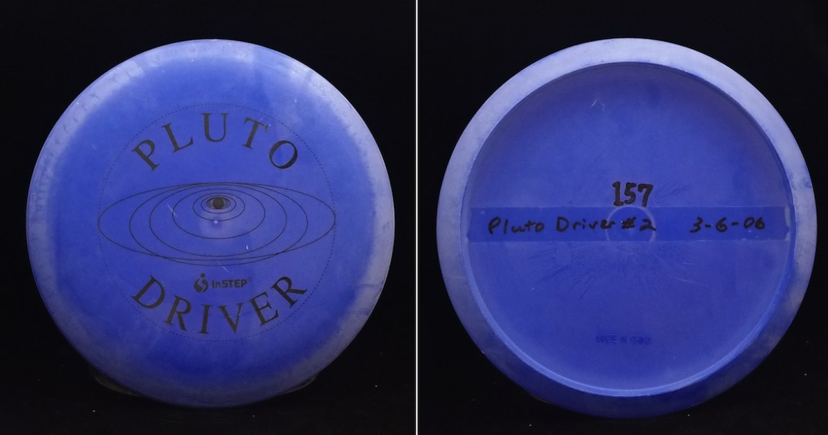 A blue disc from top and bottom. The top says "Pluto Driver" in black.