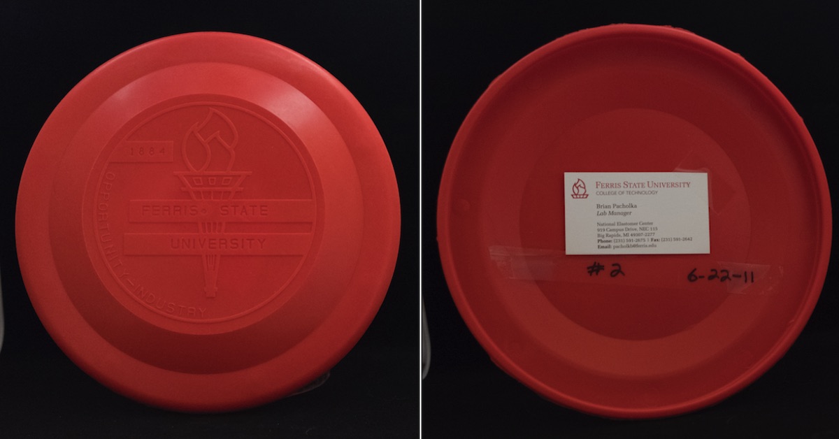 A red disc with a flight plate noticeably raised from the rim seen from top and bottom
