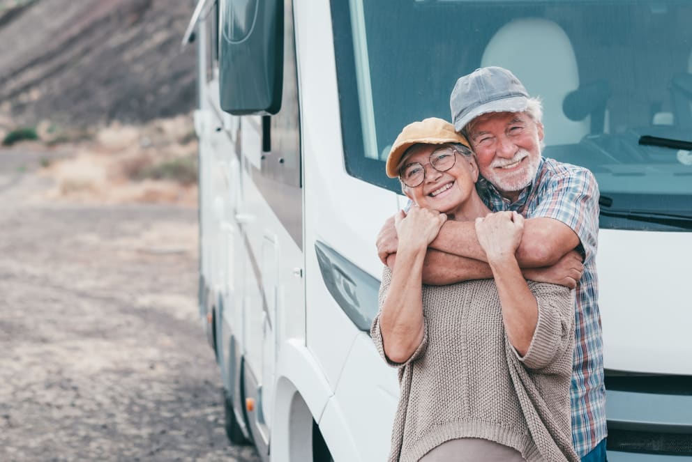 older couple infront of RV