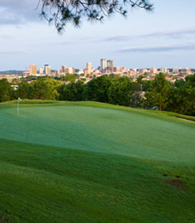 Highland Park Golf Course with cityscape background