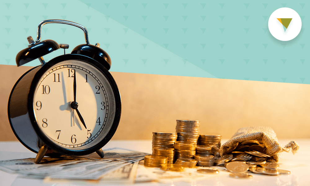 Clock next to stacks of coins