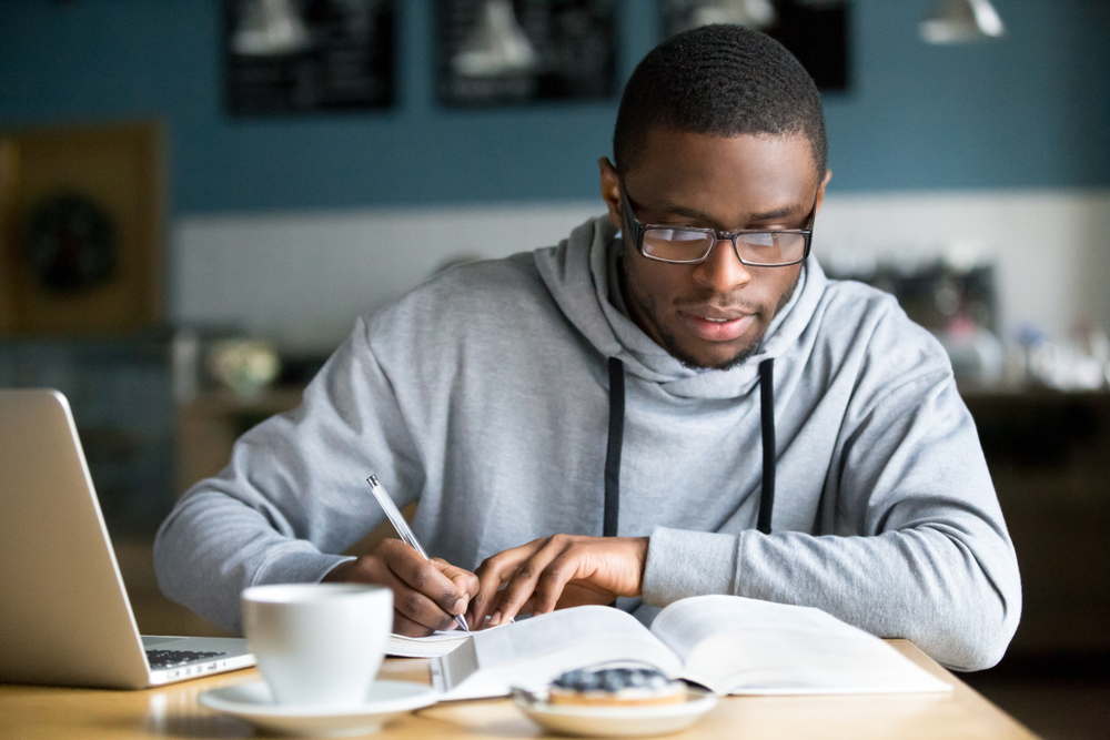 man making notes