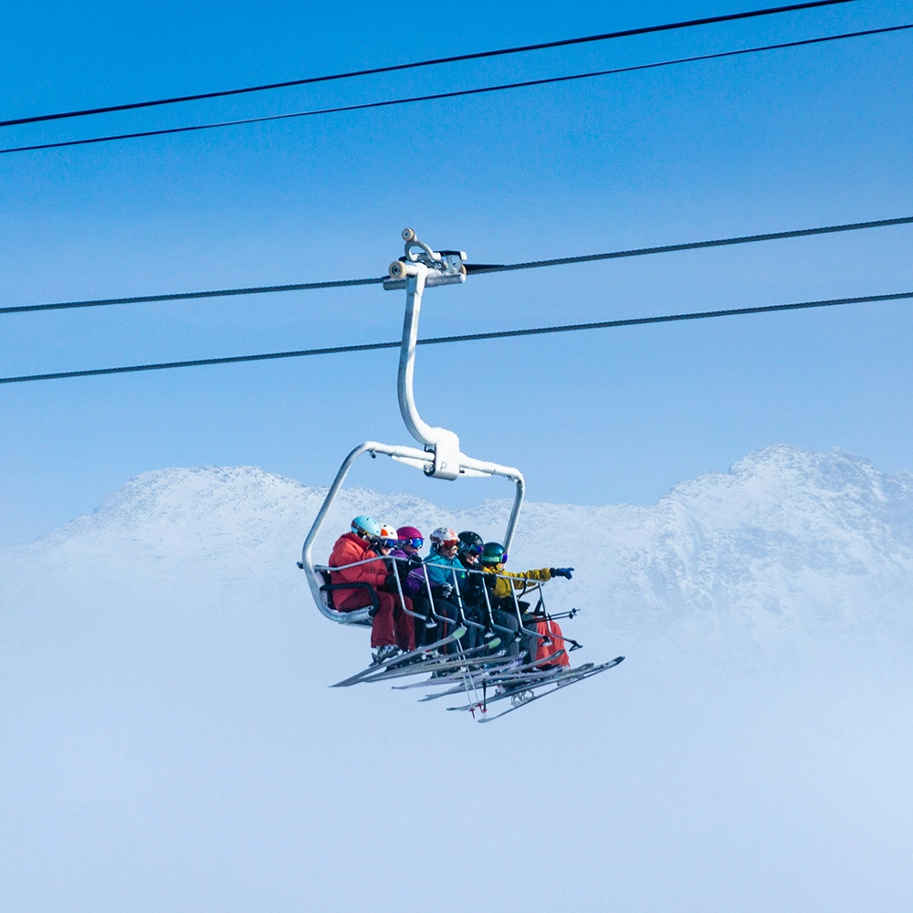 Friends on ski lift.webp