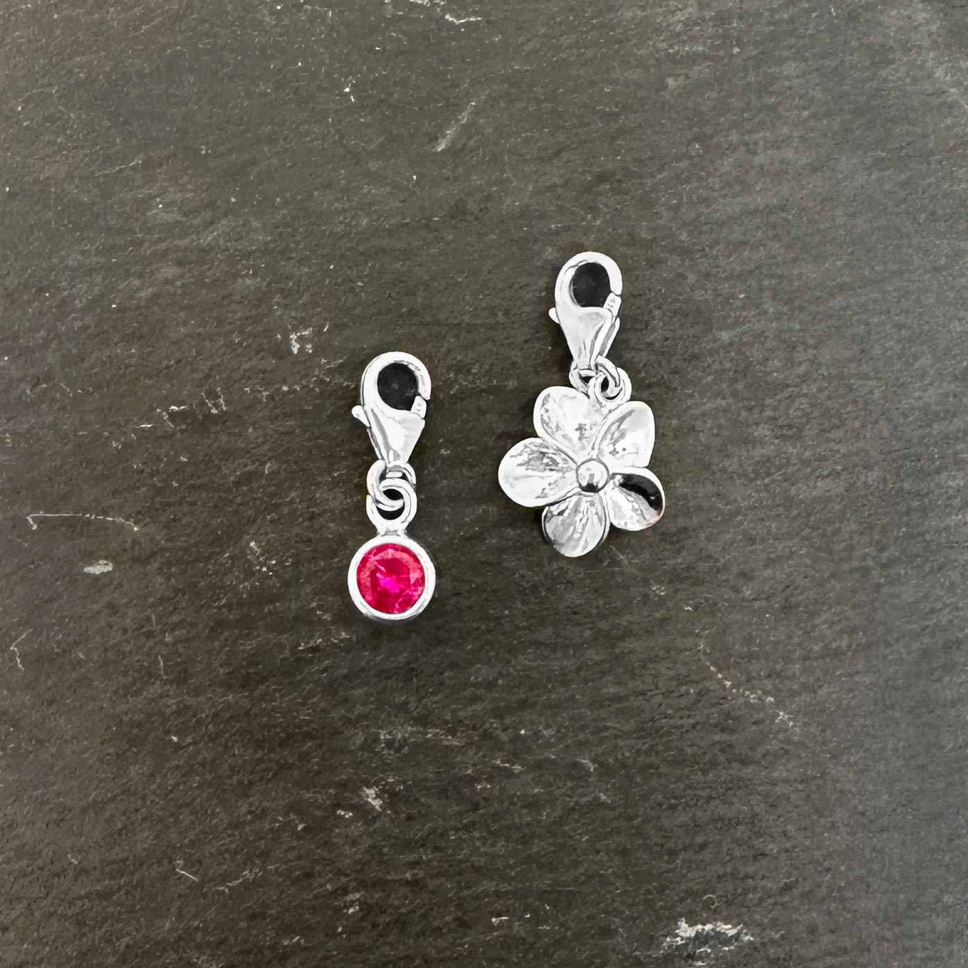 pink cz charm with lobster clasp and silver flower charm with lobster clasp