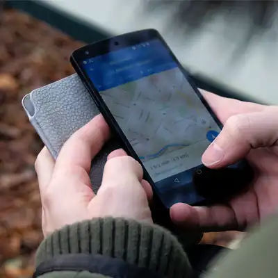 Person using a map app on their phone.