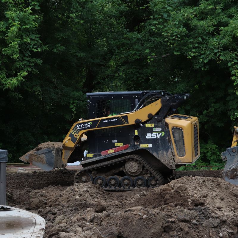 ASV Compact Track Loader working on a muddy site
