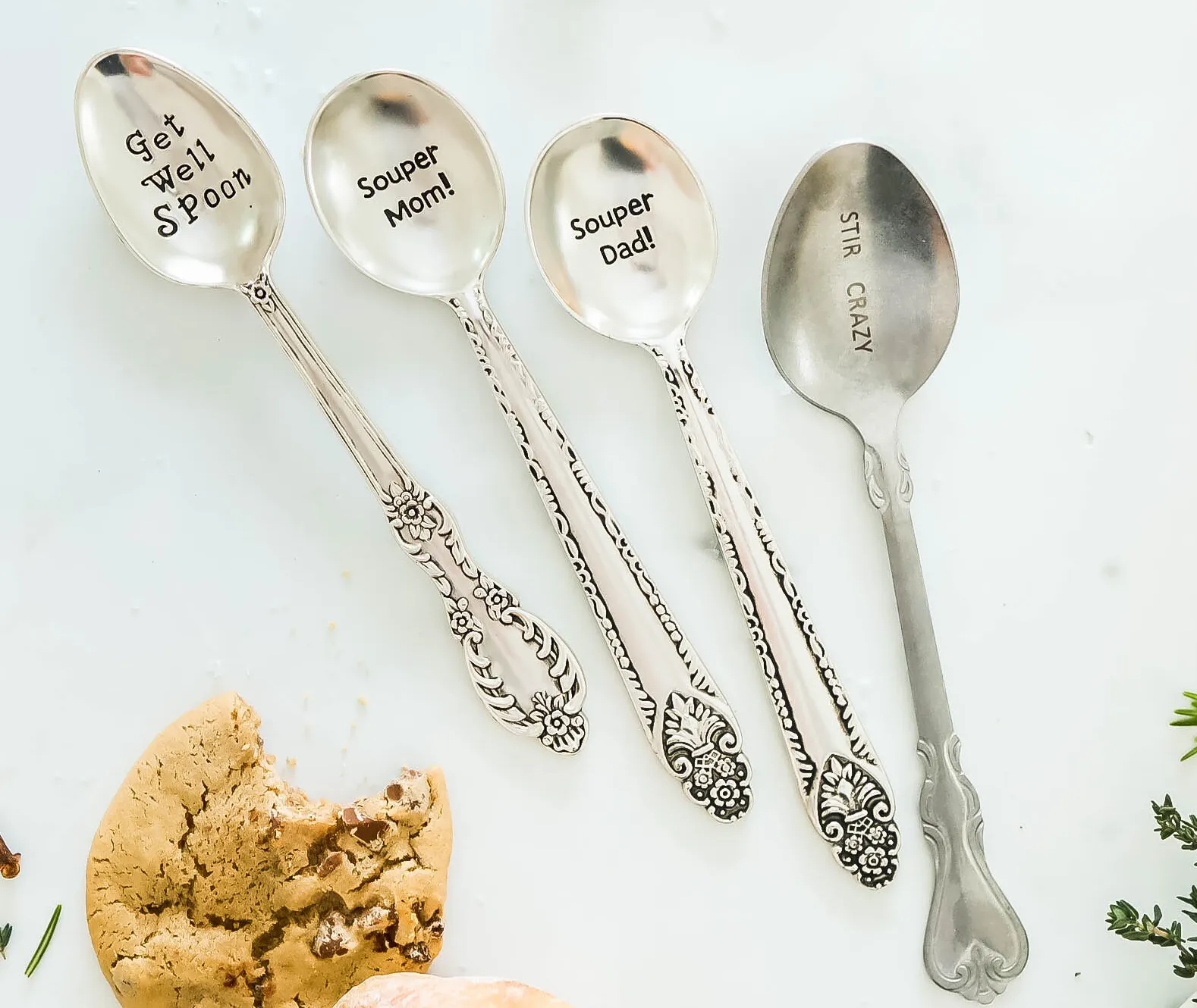 4 spoons stamped with puns such as "Get well spoon".
