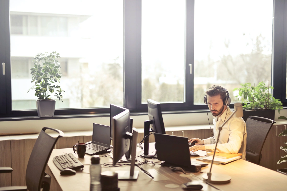 Man working with CRM software.