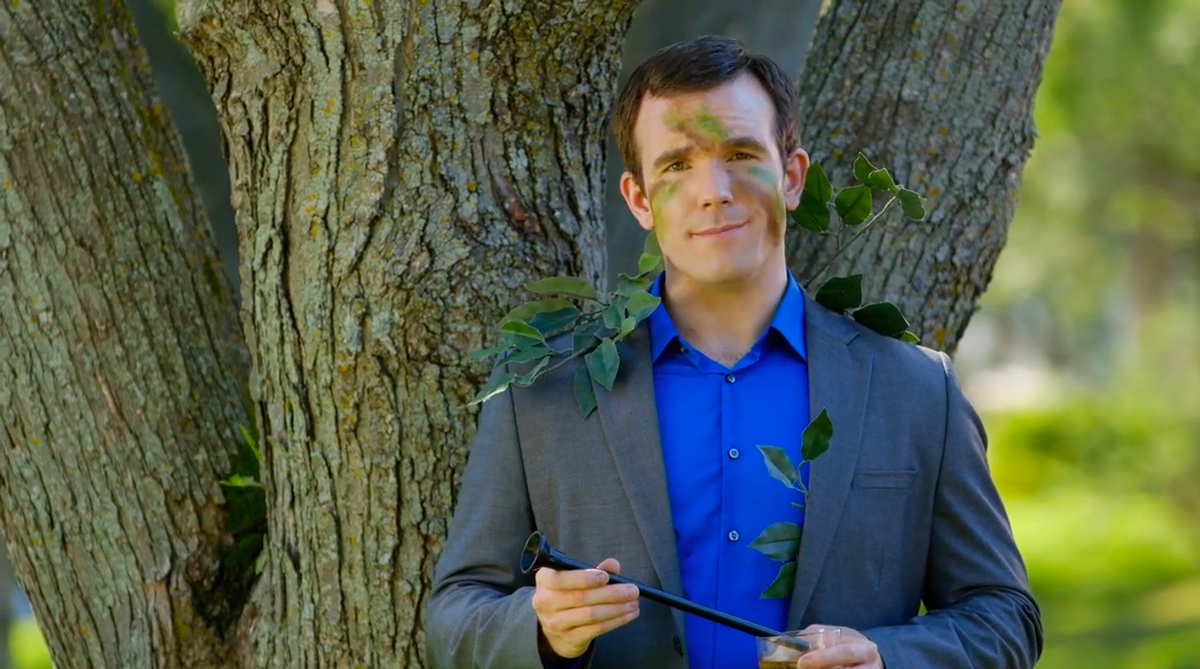 Man in a suit with a camouflage pattern on his face