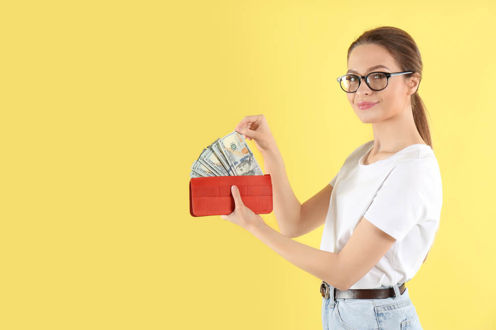woman with full wallet of payday loan cash