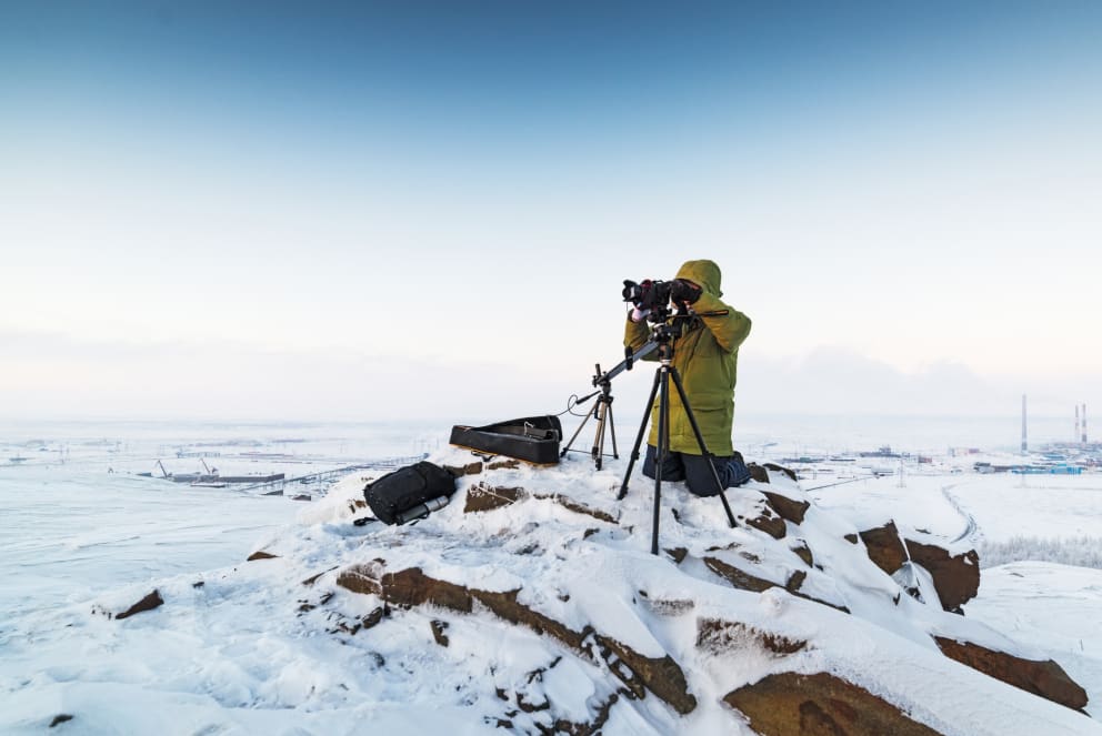 man on winter photography expedition