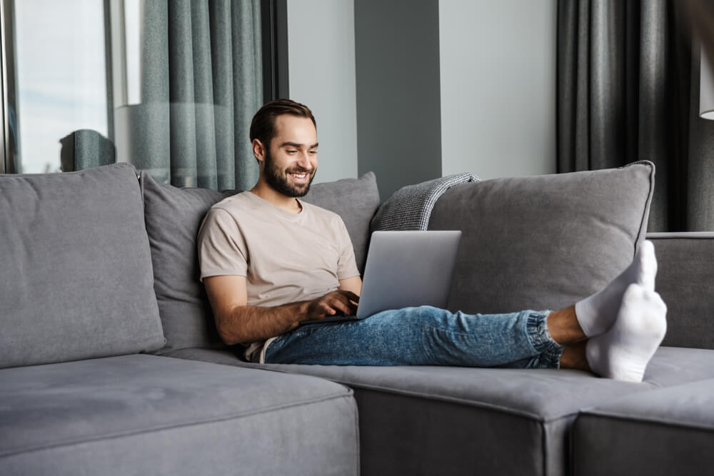 man getting an online title loan at home