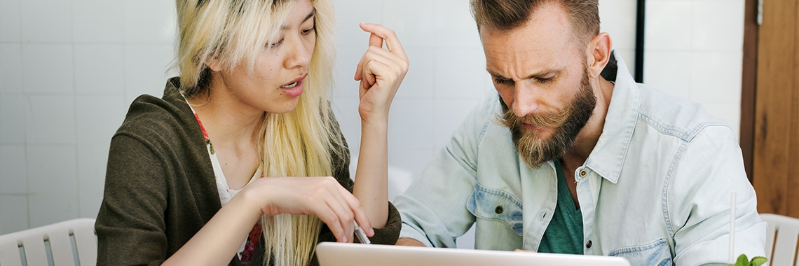 Girl talking to a man over the computer.