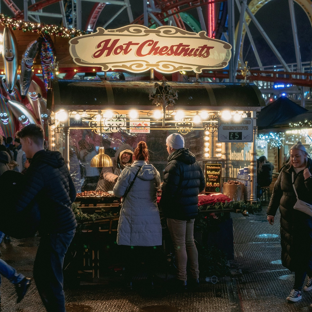 Couple getting hot chestnuts.webp
