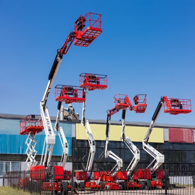 Articulating boom lifts at different height extensions