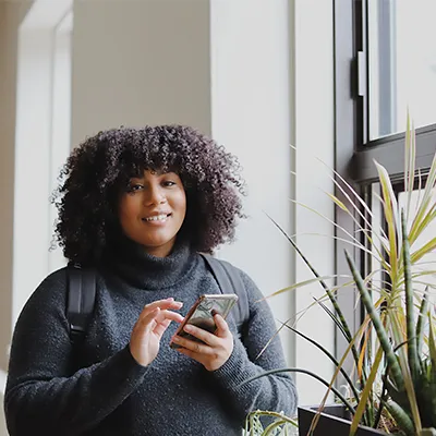 Young woman using phone.