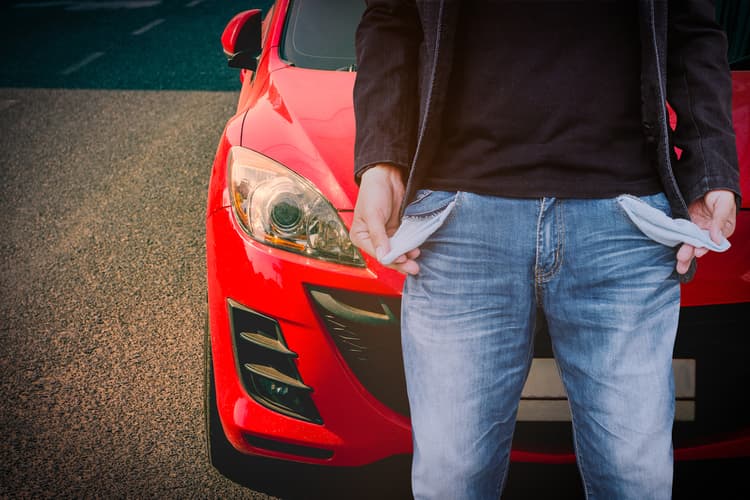 man with empty pockets using car for title loan