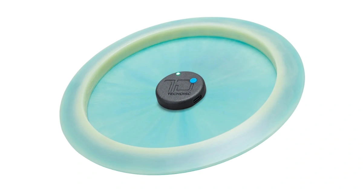 A blue disc upside down with a round black sensor in the middle