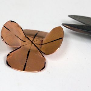 Cutting copper petals