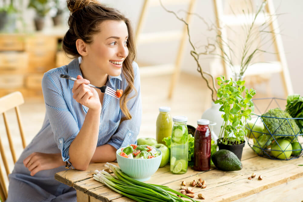 woman eating healthy after fixing her credit