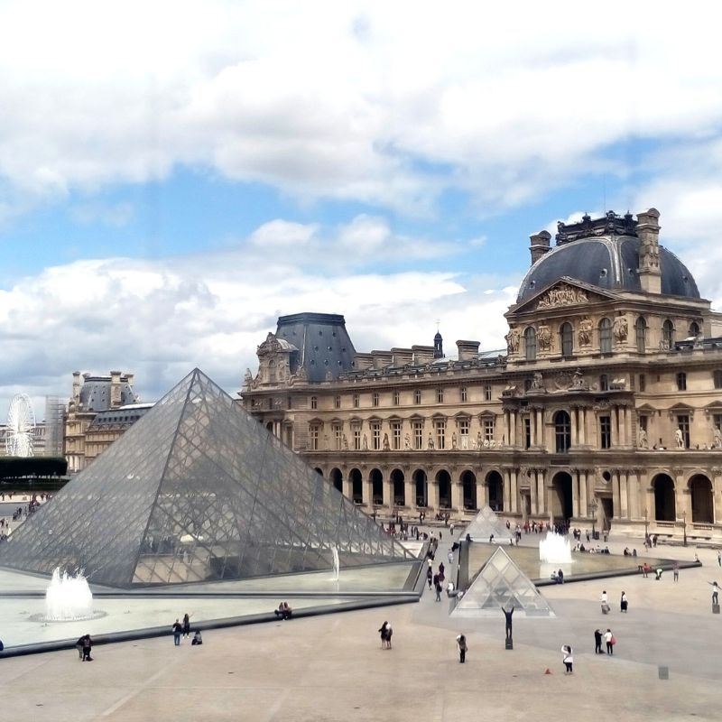 the Louvre Pyramid with the main building in the background