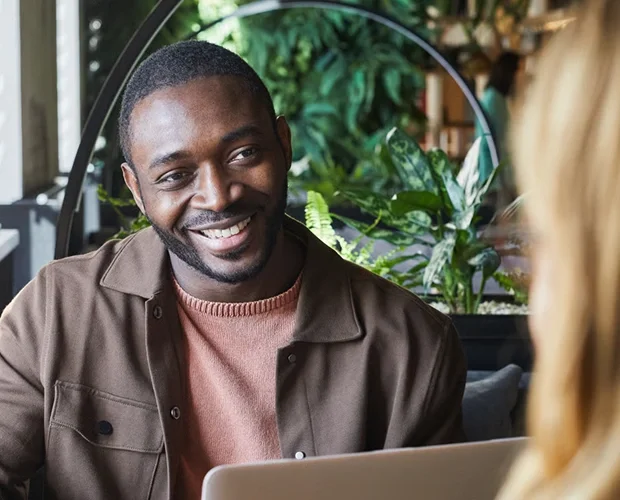 Finance representative smiling at desk