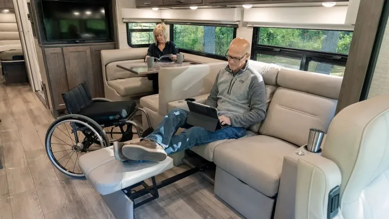 Interior of RV with man, woman and wheelchair