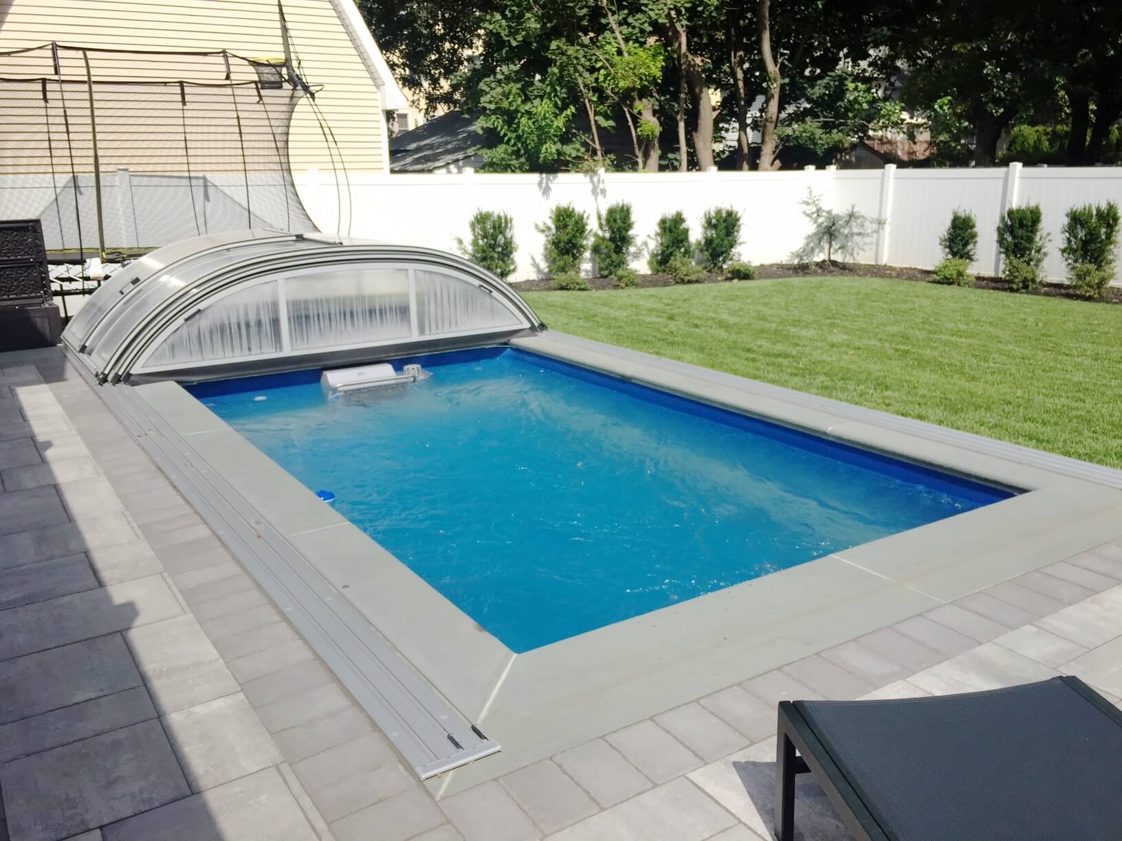 a fully in-ground Endless Pool enclosure, partially retracted.