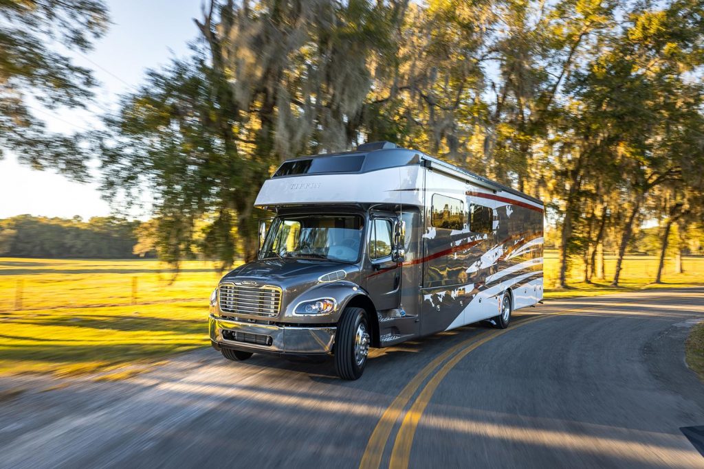 RV driving on a pretty road