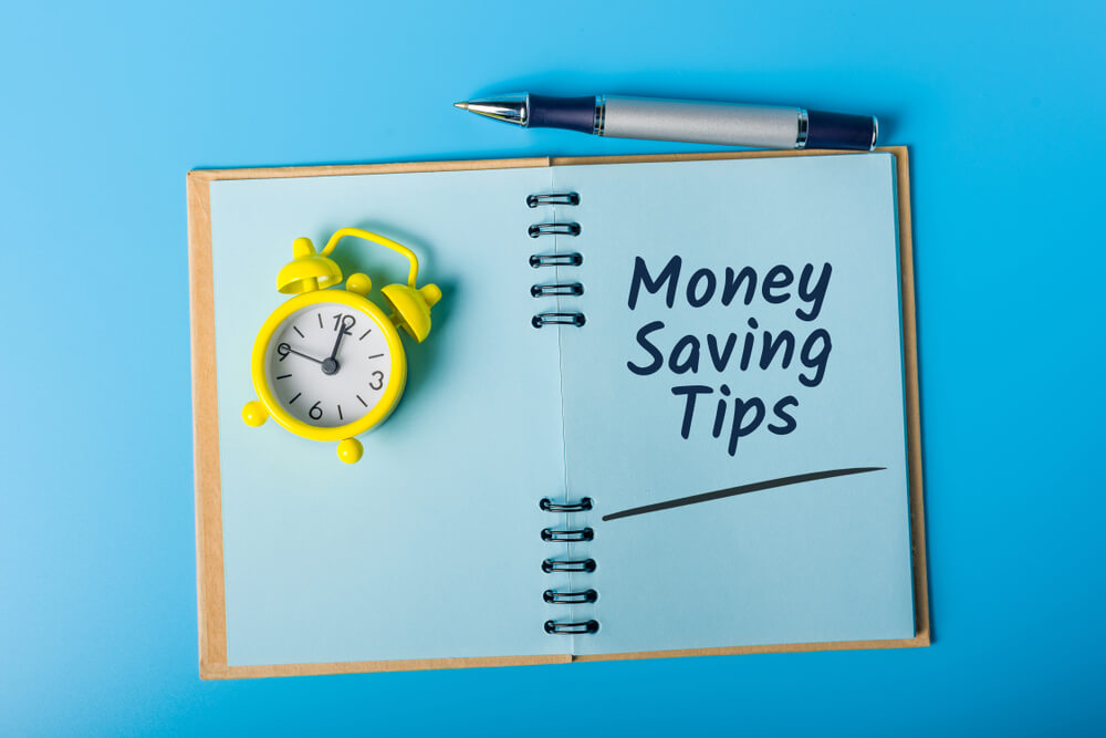 saving money tips written in a notepad